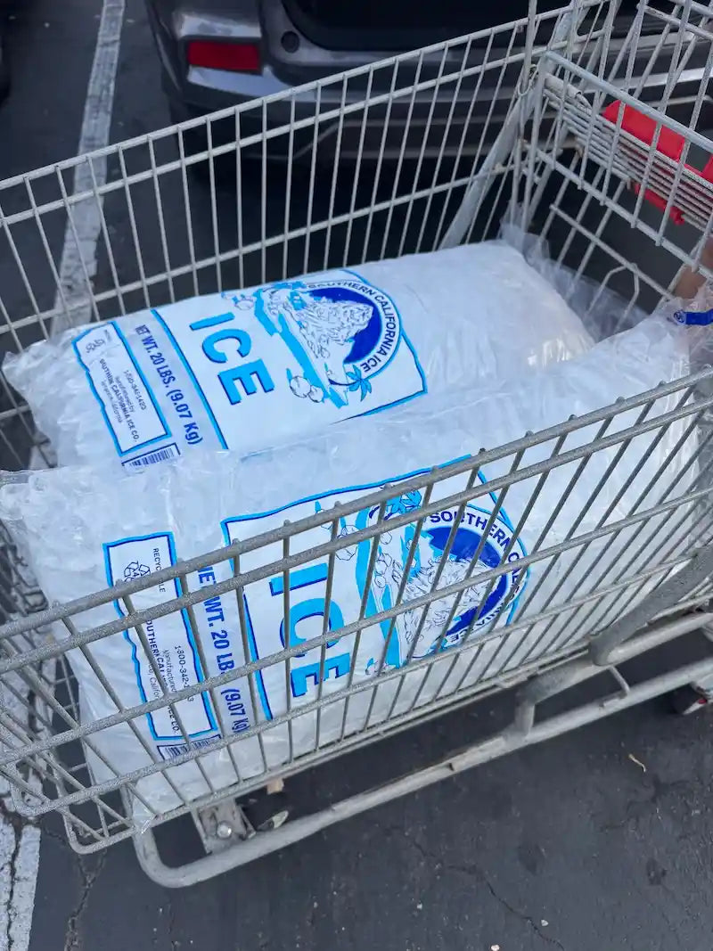 Large bags of ice in a shopping cart, used for OB Tie Dye’s signature ice-dye method.