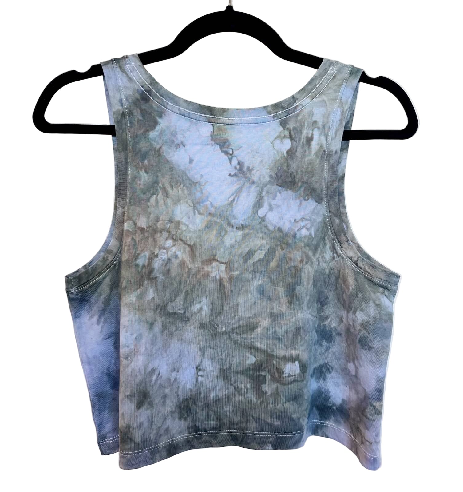 Back view of muted green and blue hand ice-dyed woman's crop tank with cloudy coastal tones