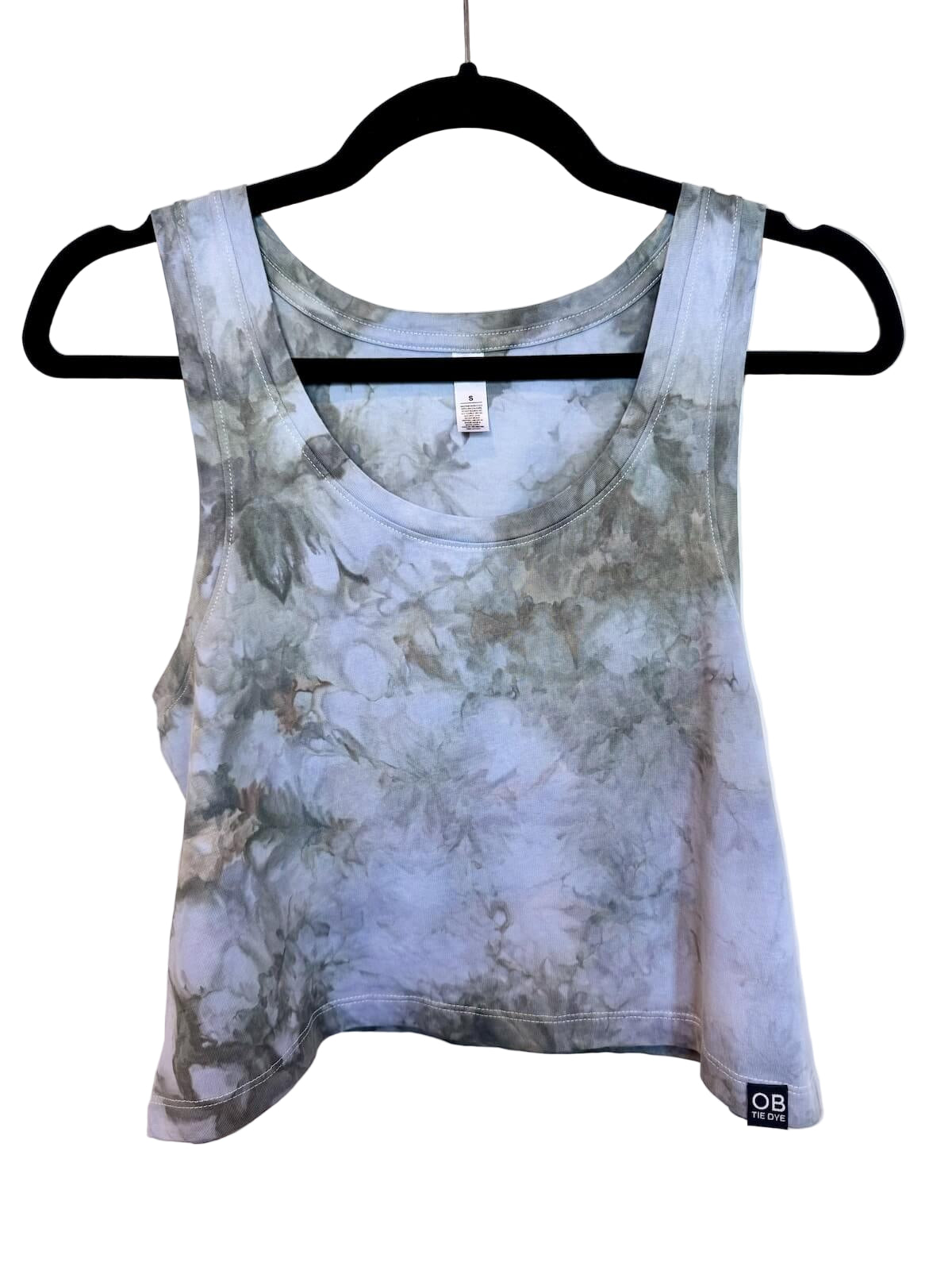 Front view of muted green and blue hand ice-dyed woman's crop tank with cloudy coastal tones