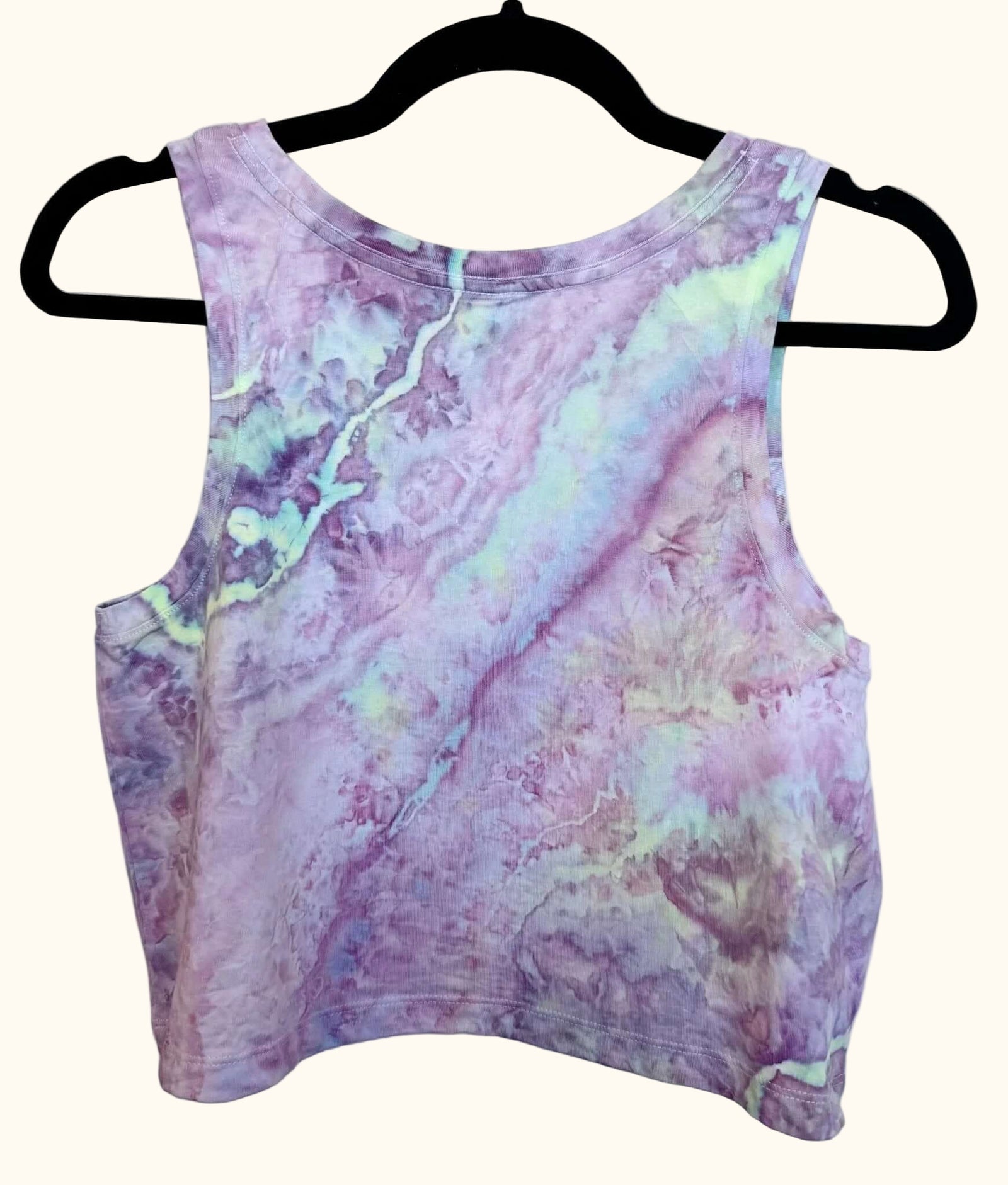 Back view of lavender purple and light green uv reactive hand ice-dyed woman's crop tank with fluid, watercolor texture