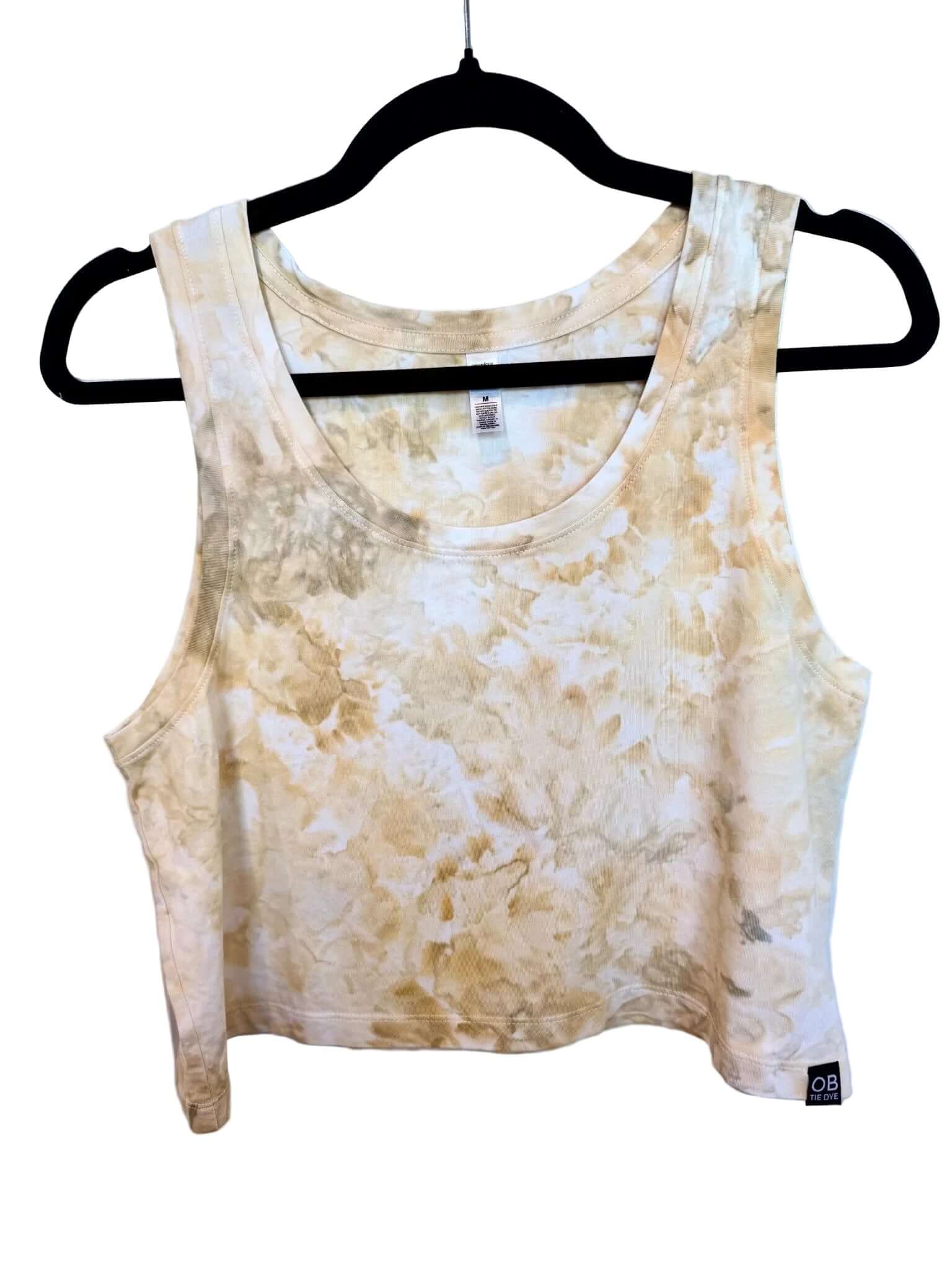 Front view of soft yellow and white sunlight tones with uv reactive dye hand ice-dyed woman's crop tank with fluid, watercolor texture