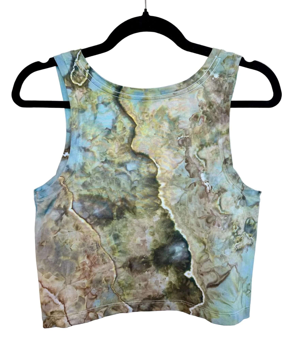 Back view of blue, green and earthy brown hand ice-dyed women’s crop tank on hanger