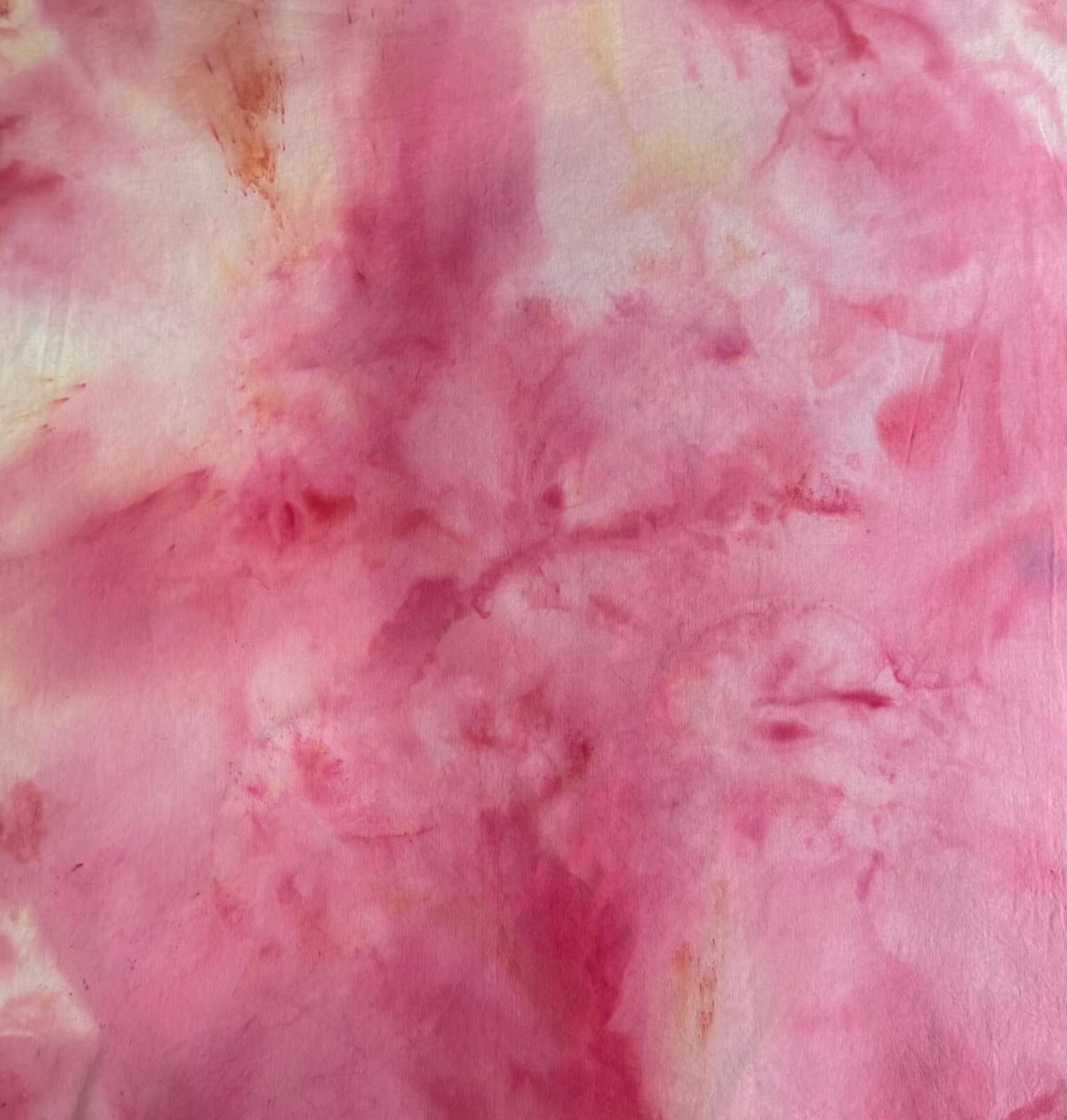 Close-up of pink and white tie-dye fabric