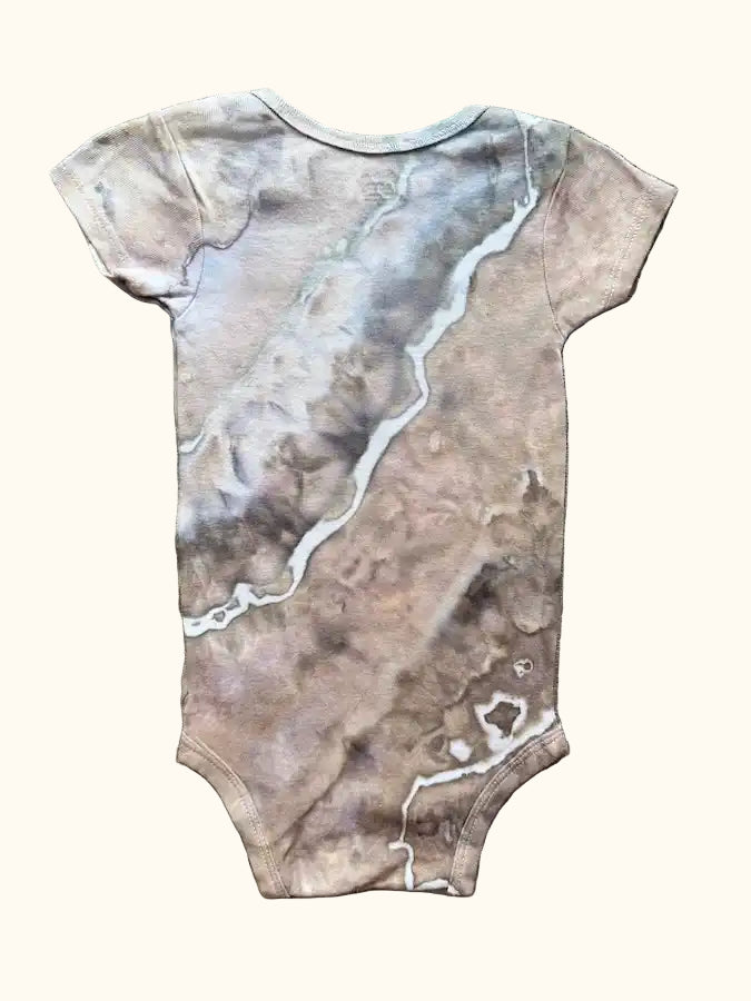 Hand-dyed ice dye hand dyed baby onesie with organic, coastal-inspired color pattern