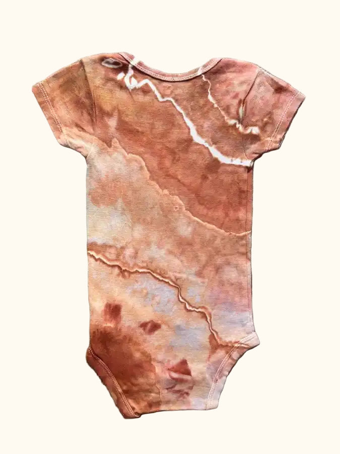 Hand-dyed ice dye hand dyed baby onesie with organic, coastal-inspired color pattern