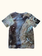 Back view of a kids’ OB Tie Dye shirt featuring blue, green, and earthy ice-dye marbling.