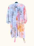 Front view of an OB Tie Dye kimono in soft pink, orange, grey, and white with an open drape.