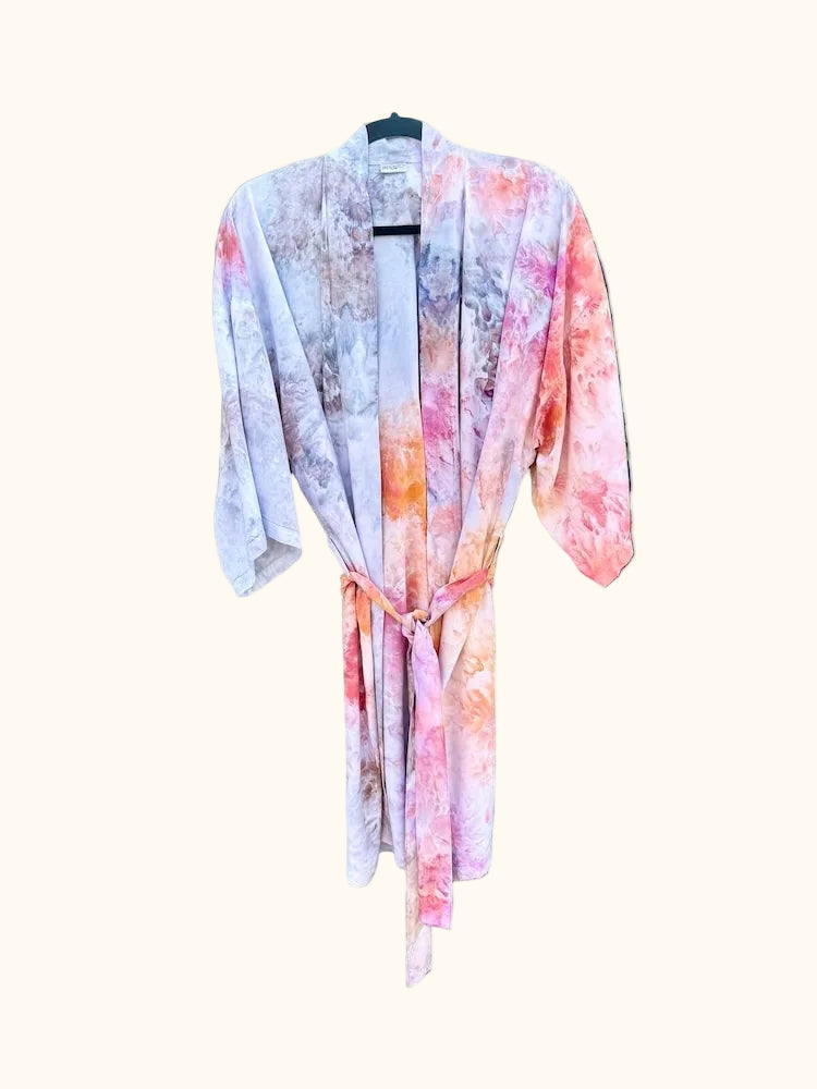 OB Tie Dye kimono tied at the waist, showing soft pastel ice-dye textures in pink, orange, and grey.