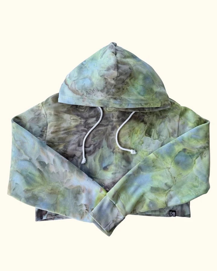 Hand ice dyed cropped womens hoodie in kelp forest with green tie dye patterns