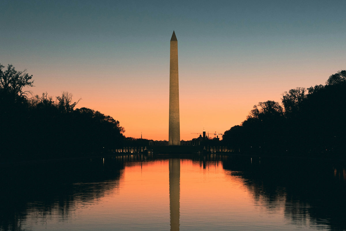 The Washington Monument reflected in the Reflecting Pool at sunset