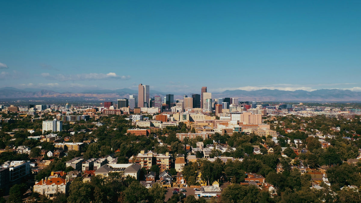 Downtown Denver skyline with the Front Range mountains behind it