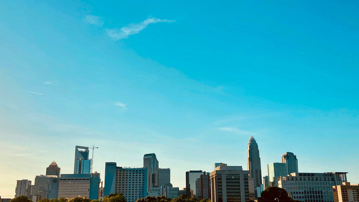 The Charlotte, North Carolina skyline under a blue sky